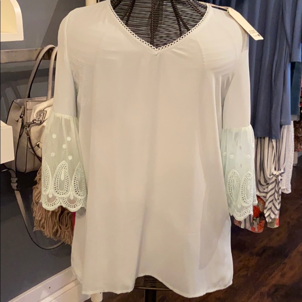 Gorgeous Mint v-neck too w/ flutter lace sleeves.